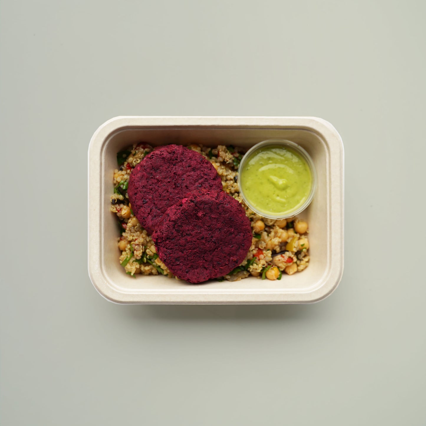 Beetroot, Black Bean, and Haloumi Fritters, Quinoa, Chickpea, Grilled Aubergine, Red Pepper, Sundried Tomato, and Olive Salad. Avocado and Lime Dressing